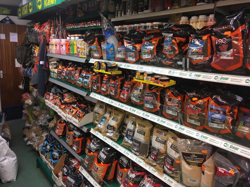 Tackle shop shelves full of groundbait