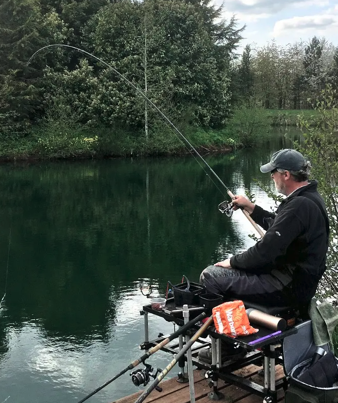 Landing a nice Bream, caught on a sliding float rig set up.