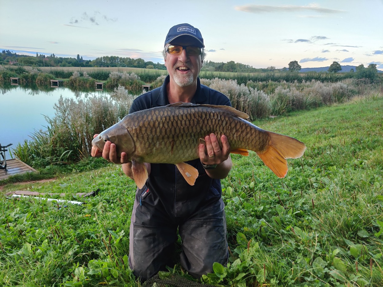 Man holding a carp