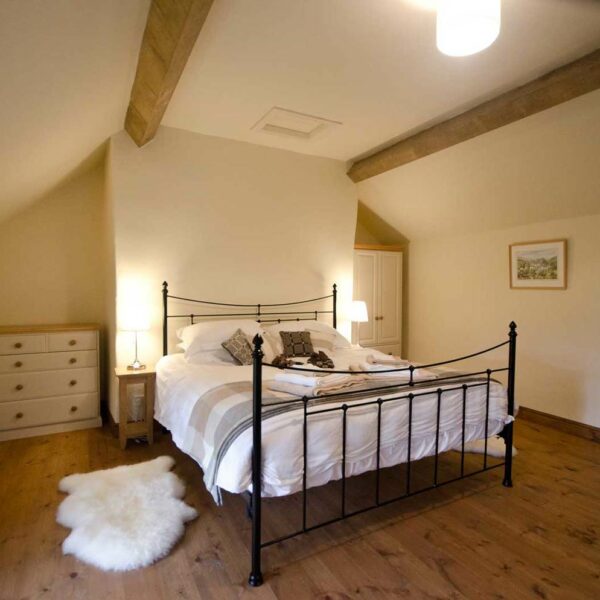 The bedroom at Cabalva Mill Cottage fishing holidays on the River Wye in Herefordshire