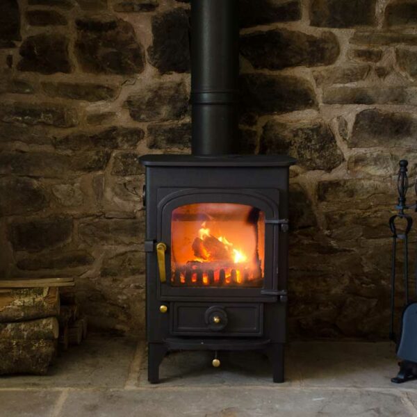 The Inglenook fire in the lounge at Cabalva Mill Cottage fishing holidays on the River Wye in Herefordshire