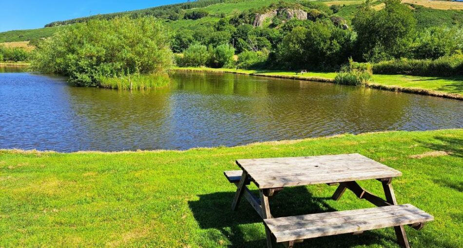 The lake at Ty Bwlcyn holiday cottage and glamping pods near Pwllheli in North Wales