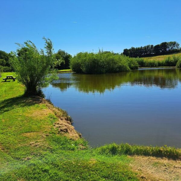 The lake at Ty Bwlcyn holiday cottage and glamping pods near Pwllheli in North Wales