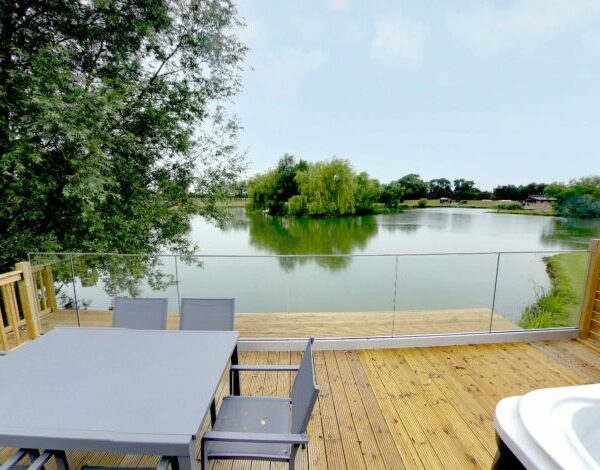 View of the lake from the Bullfinch veranda at Noah's Retreat in Lincolnshire